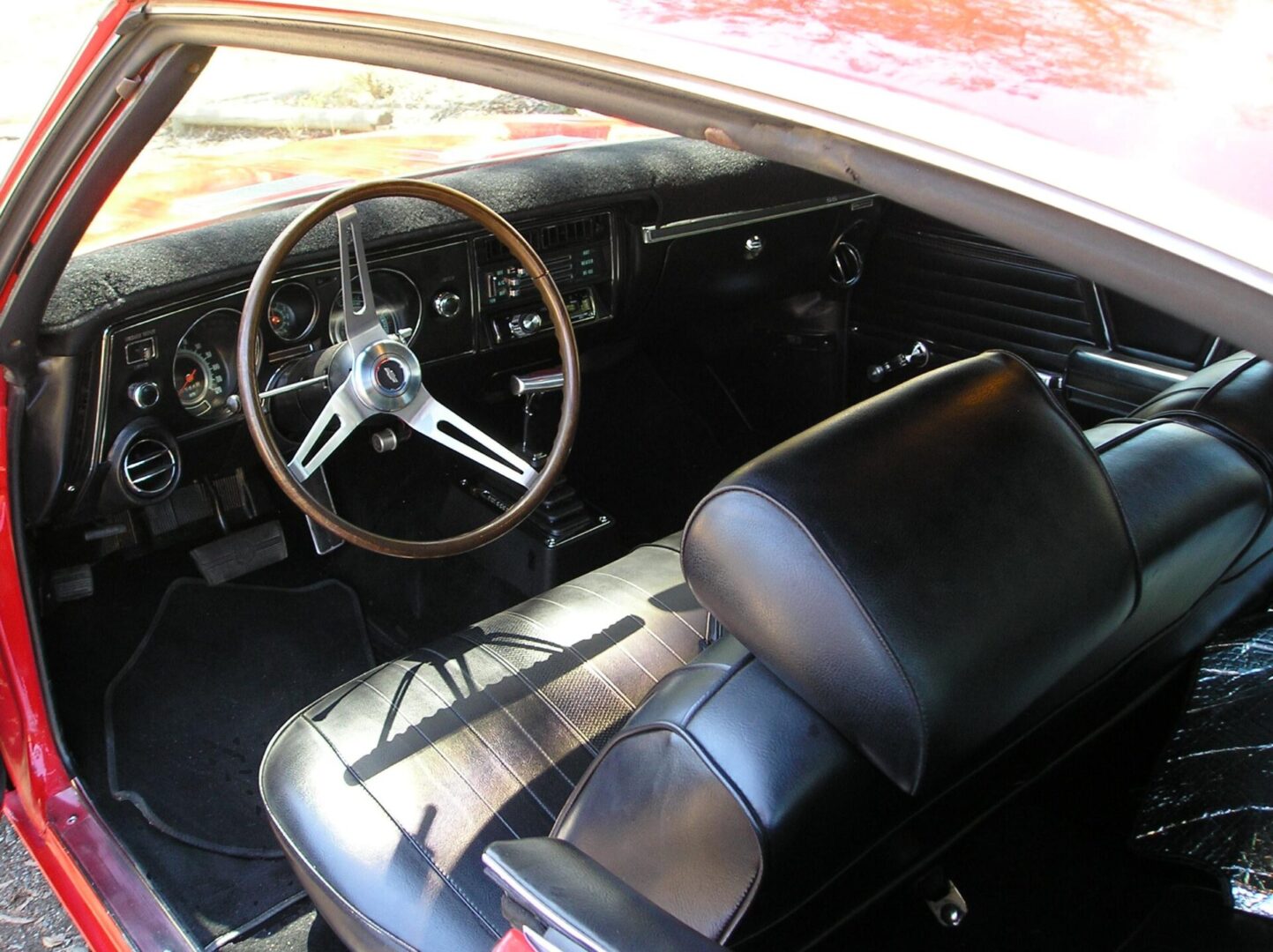 The interior of a red car.