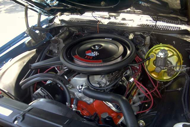 The engine compartment of a classic car.