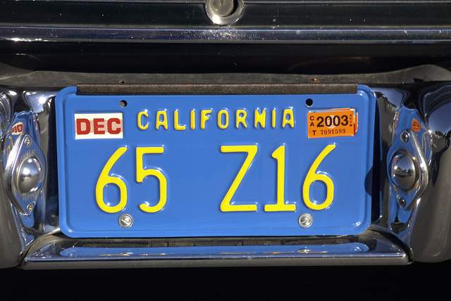 California license plate on a blue car.