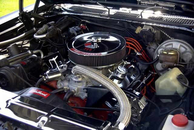The engine compartment of a classic car.