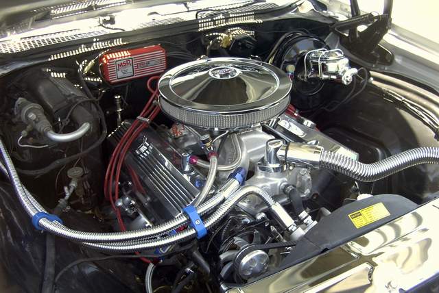 The engine compartment of a classic car.